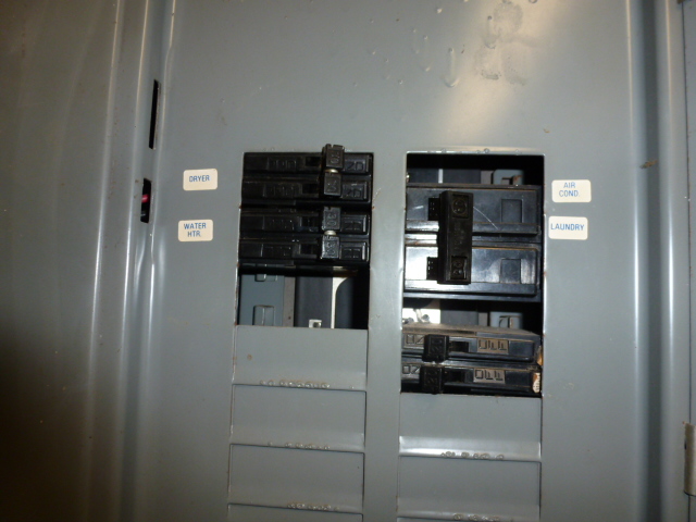 breaker panel with open slots. This is an electrocution hazard. 